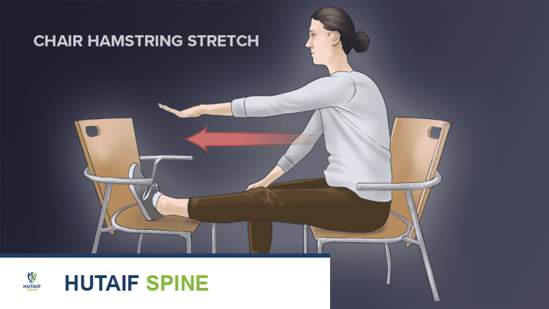 A woman showing seated hamstring stretch exercise.