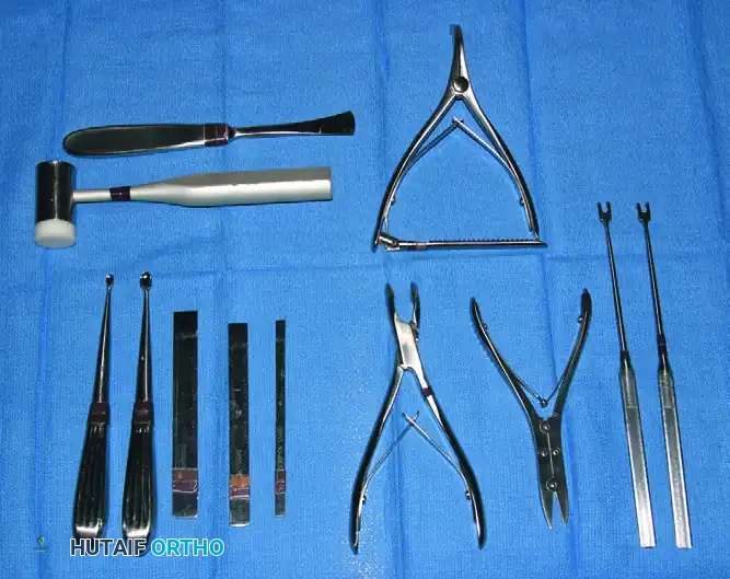 FIGURE 64-12 Instruments useful in microvascular and digital nerve surgery include small irrigation bulb, microvascular clamp, microneedle holder, pickups, and scissors of assorted lengths.
